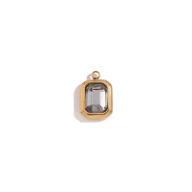 Gold bezel charm pendant with clear emerald-cut stone
