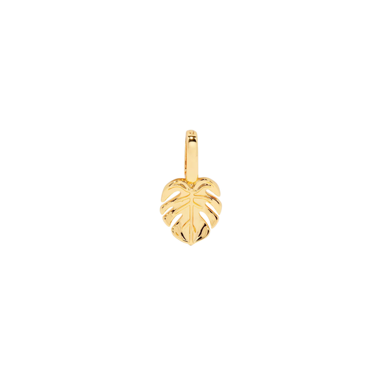Gold palm leaf charm on a white background.