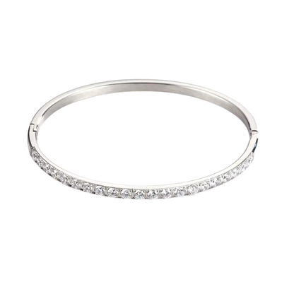 Cala Bangle by KJAYDE, a slim silver-toned bangle with clear crystal detailing across the front.