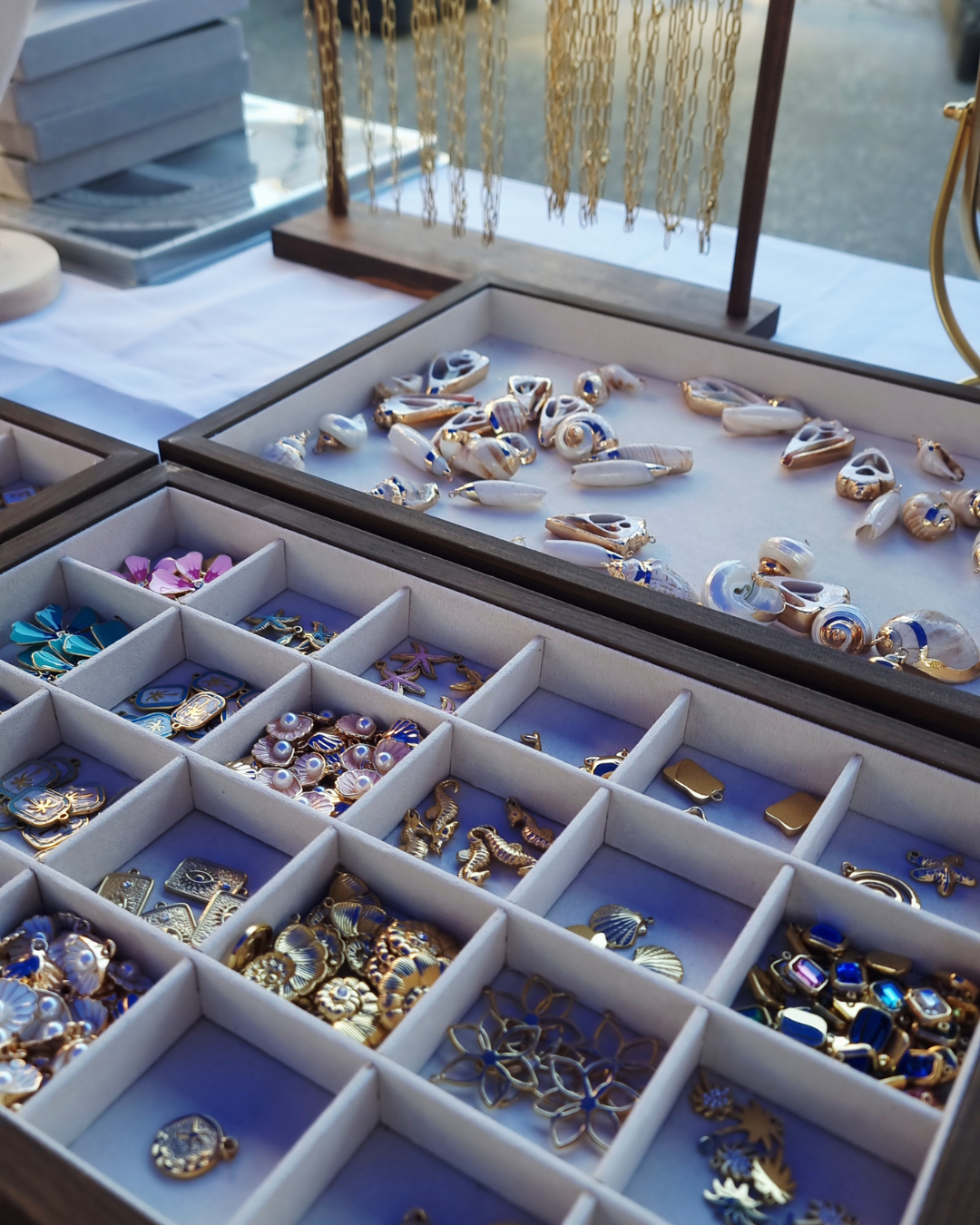 Custom bracelet builder tray with gold, pearl, shell, and ocean-inspired charms — waterproof and 18k gold plated