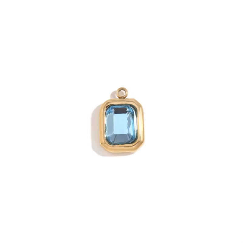 Gold bezel charm pendant with light blue emerald-cut stone