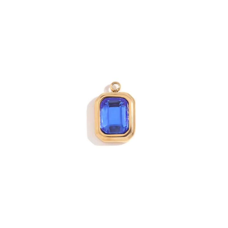 Gold bezel charm pendant with royal blue emerald-cut stone