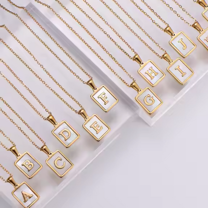 Gold rectangle initial letter charm A–Z with white enamel inlay