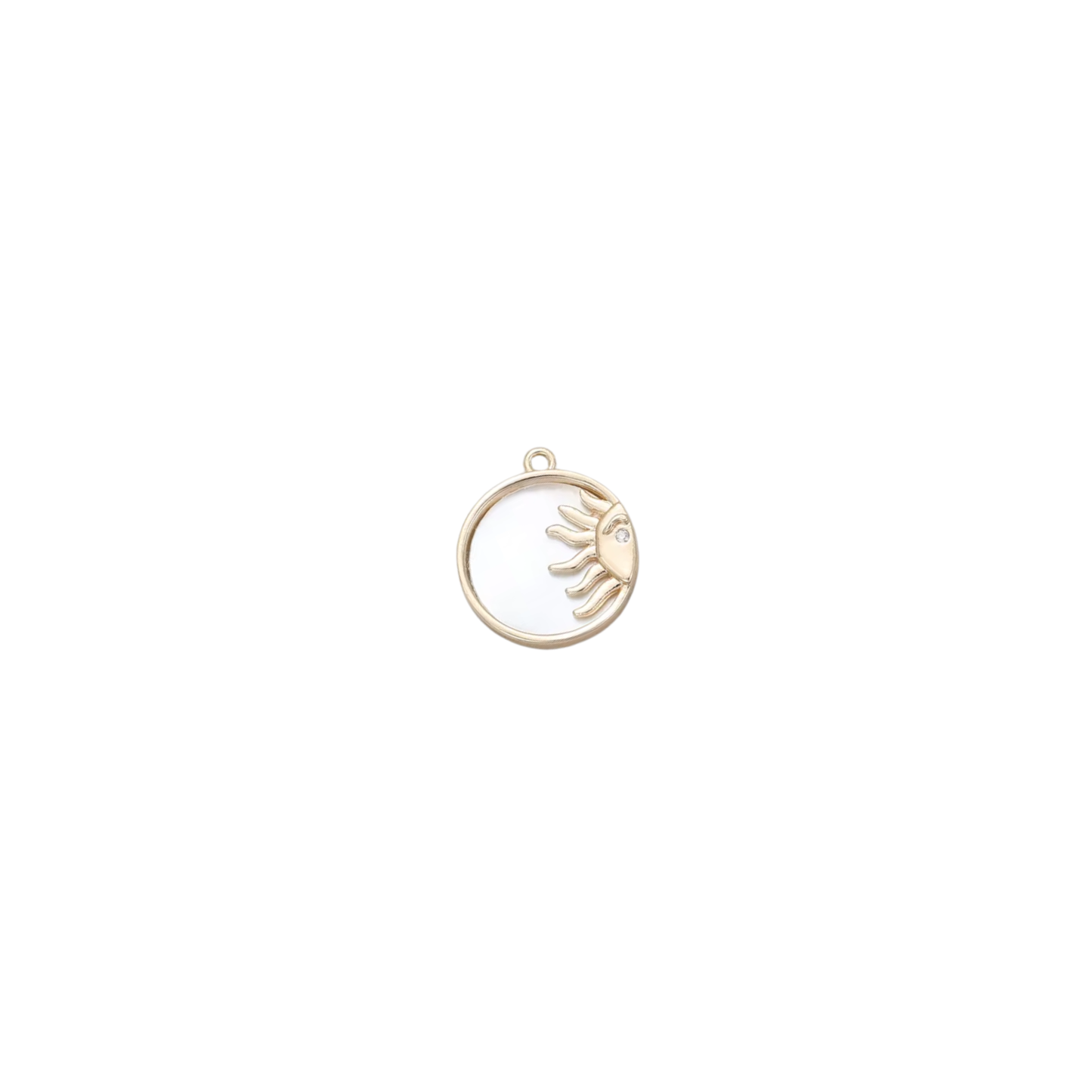 Gold circular sun charm with a crystal detail on a white background