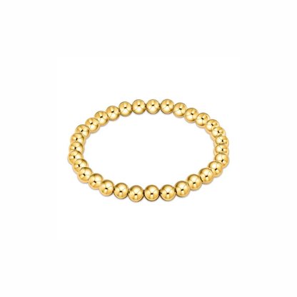 Solstice bracelet with polished round beads in 18k gold-plated, waterproof, tarnish-resistant stretch design for layering and everyday wear