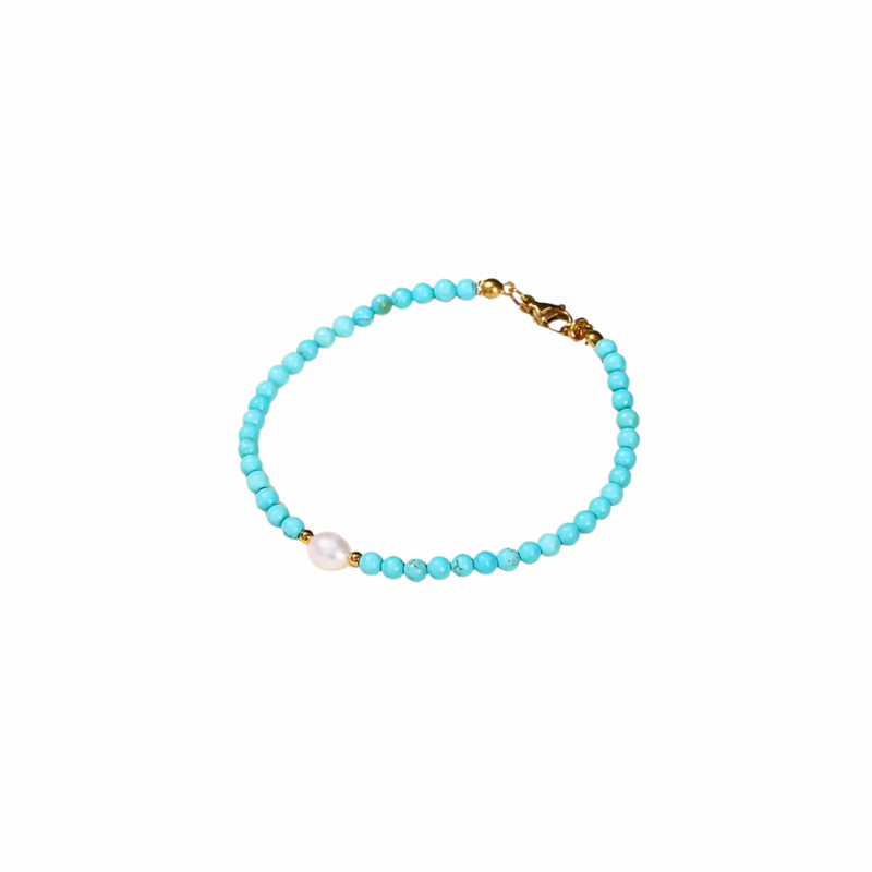 Teal beaded bracelet with freshwater pearl and gold accents. Handmade, waterproof, and stackable — perfect for beach days and laid-back layering
