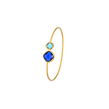 Luna Cuff in 18K gold-plated stainless steel featuring deep blue and aqua faceted crystals with a waterproof, tarnish-resistant finish.