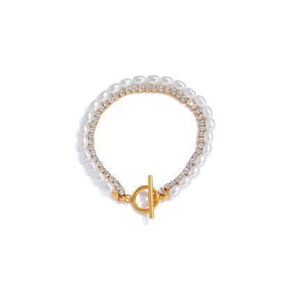 Pearl Tide gold bracelet featuring delicate pearl details and sparkling crystal accents in a coastal-inspired design.
