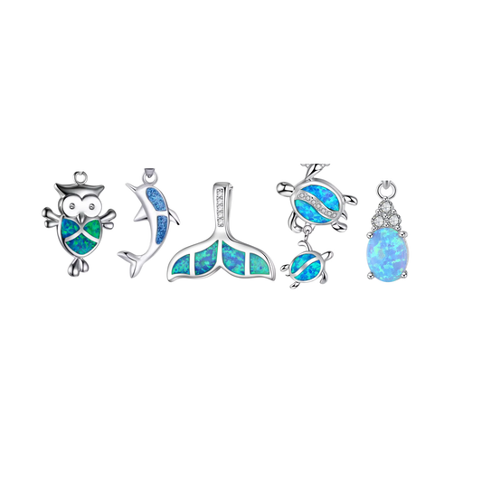 Silver opal charm collection featuring owl, dolphin, whale tail and oval opal pendant designs with blue and green opal-style detailing