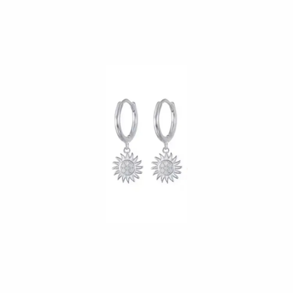Sunburst silver huggie hoop earrings with radiant sun charm and pavé sparkle