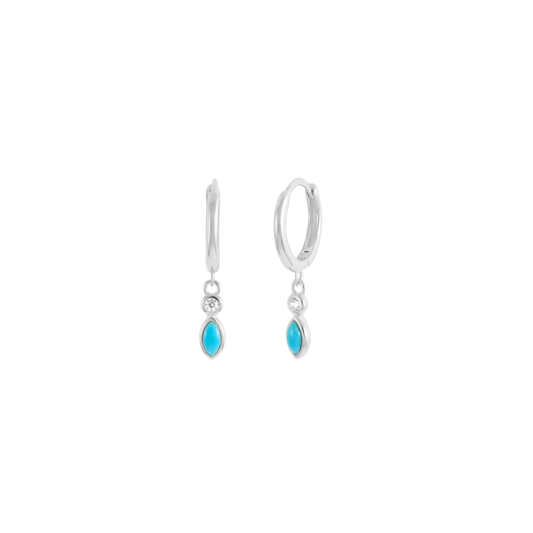 Silver huggie hoop earrings with small turquoise and clear crystal teardrop charms, minimal ocean-inspired style